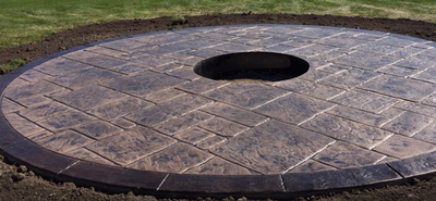 Stamped concrete circular patio with built in patio