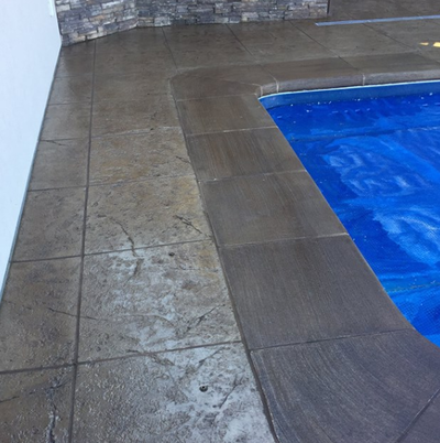 Two tone stamped concrete pool decking at Maumee, Ohio home