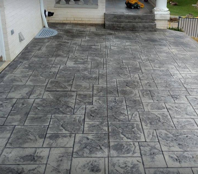 Gray stained concrete patio with steps leading into this Ohio residence.