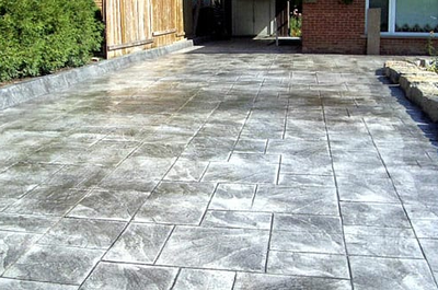 Grey glossy finished stamped concrete patio in Toledo, Ohio