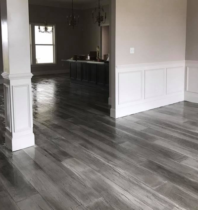 Dark gray stained concrete floor in Sylvania, Ohio home 